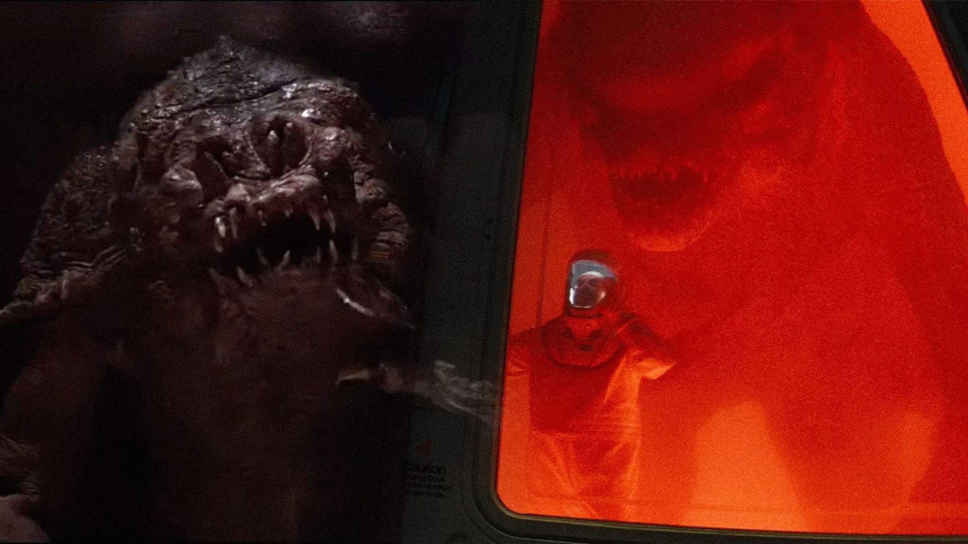 Monstruo con cabeza enorme, con un monstruo similar sentado detrás de un cristal en un laboratorio cercano