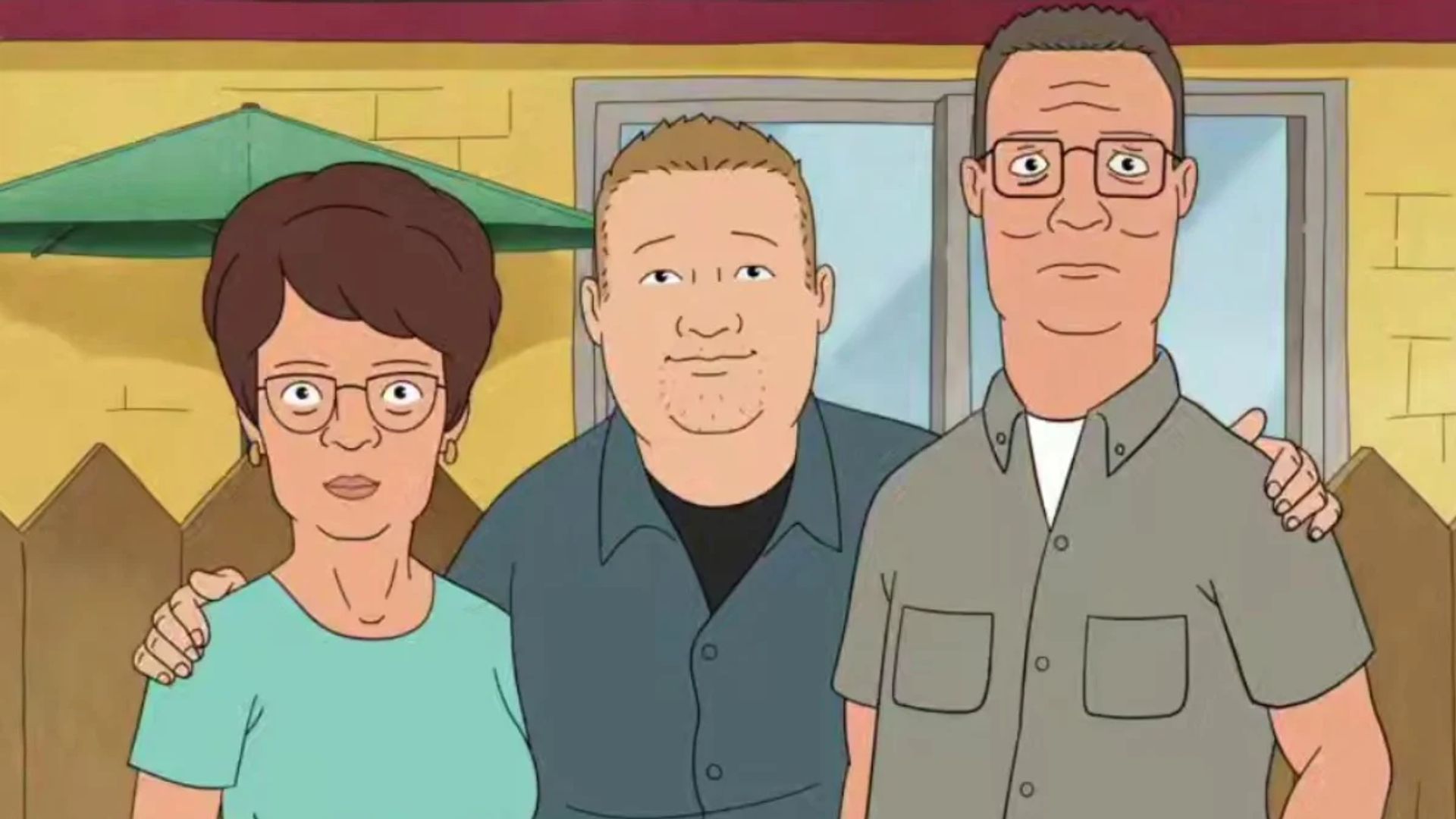 Escena de la serie animada King of the Hill, Hank, Bobby y Peggy Hill abrazándose